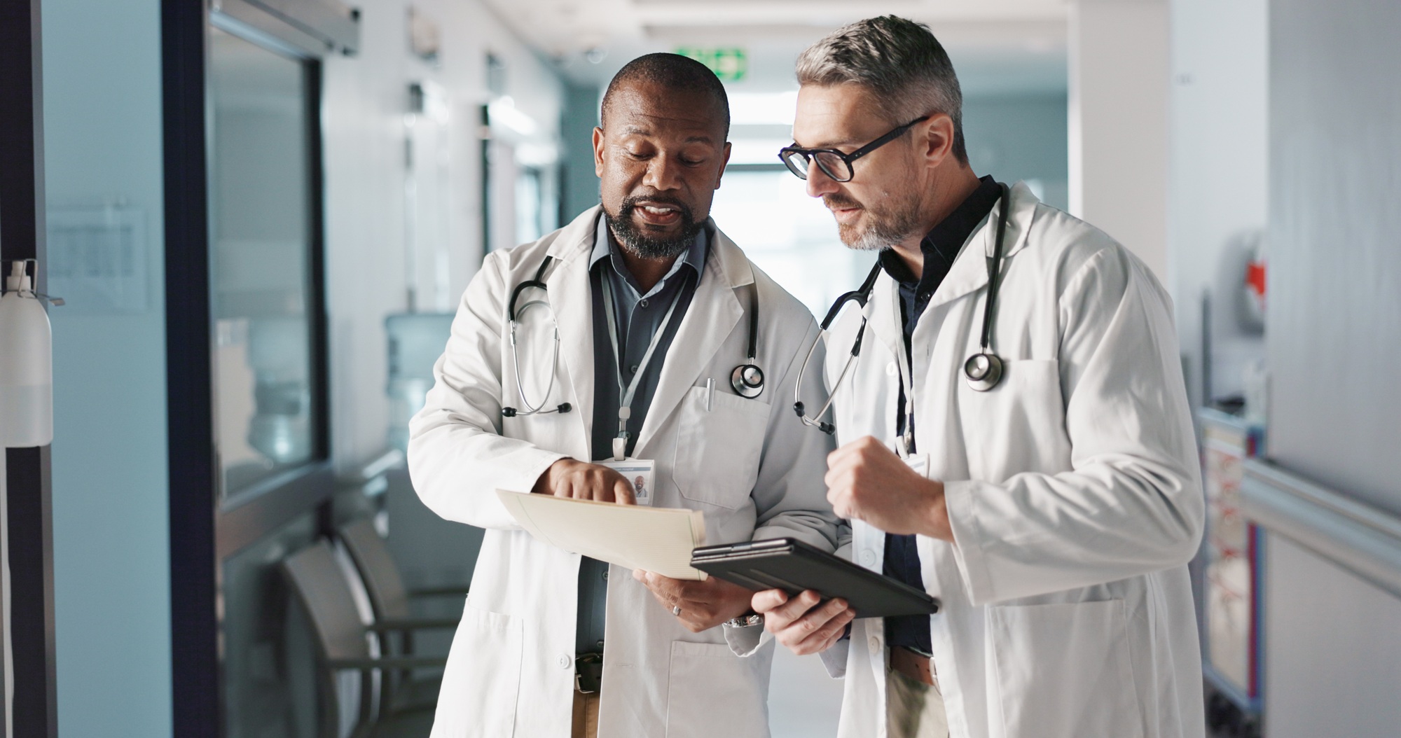 Doctors, teamwork and advice with documents, hospital folder and patient charts for healthcare plan Doctors, teamwork and advice with documents, hospital folder and patient charts for healthcare plan